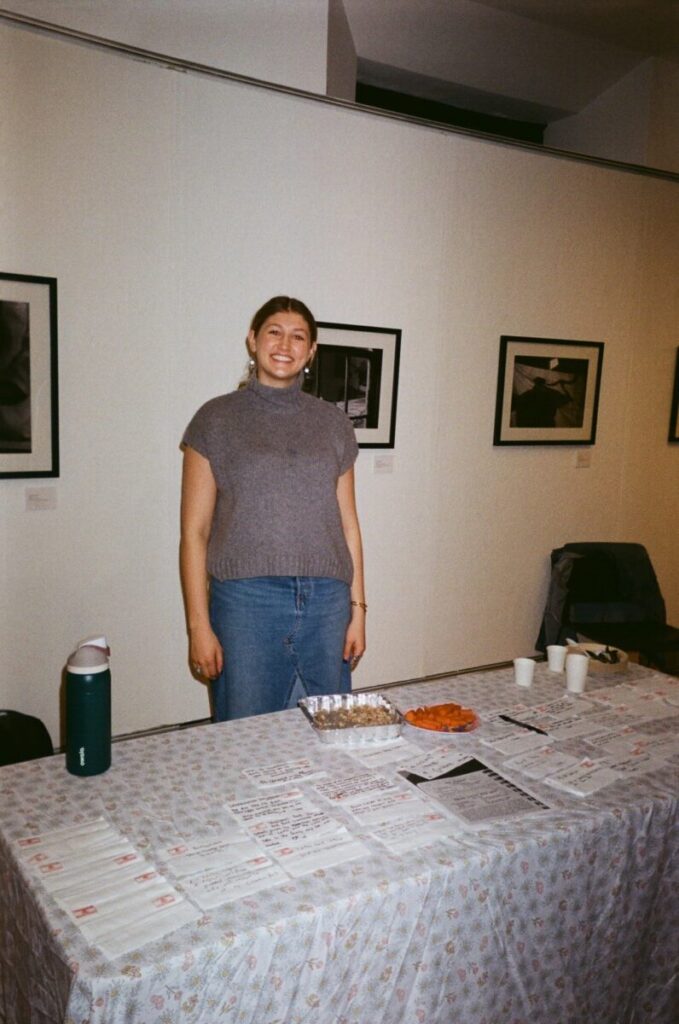 Elizabeth Weldon offered hushweh she made from a recipe by her sithu and napkins with questions about food and culture for tasters.